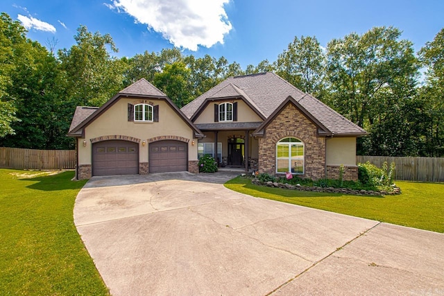 5611 Pear Tree Dr, Little Rock, AR 72206 - view of front of home with stucco siding, driveway, an attached garage, and a shingled roof