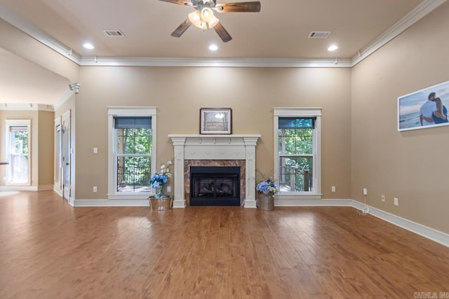 5611 Pear Tree Dr, Little Rock, AR 72206 - unfurnished living room with crown molding, wood finished floors, plenty of natural light, a ceiling fan, and a high end fireplace