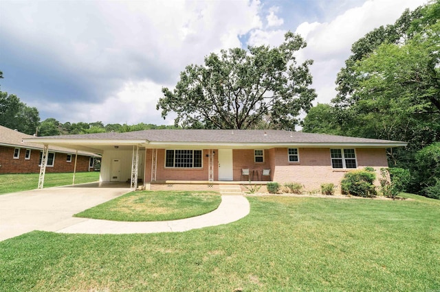 6924 W Markham St, Little Rock, AR 72205 - ranch-style house with brick siding, a carport, driveway, and a front yard