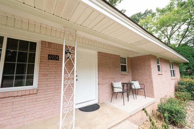 6924 W Markham St, Little Rock, AR 72205 - entrance to property featuring brick siding and a porch