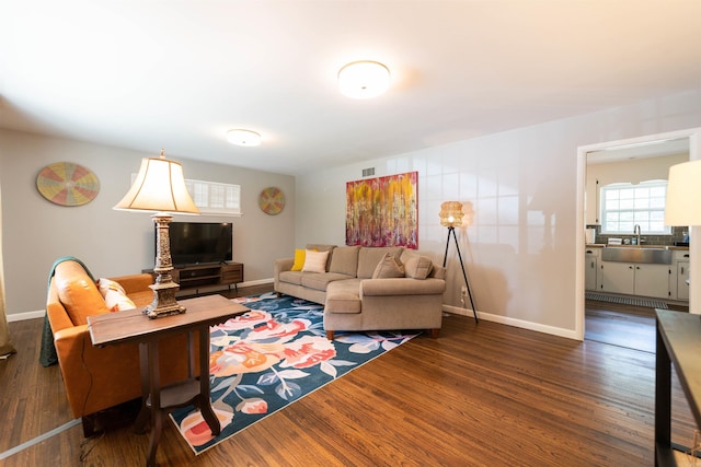 6924 W Markham St, Little Rock, AR 72205 - living area with dark wood-style floors and baseboards