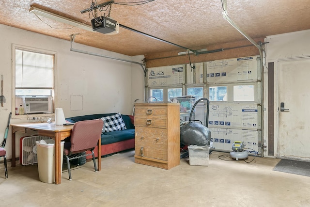 234 Robin Ln, Walnut Ridge, AR 72476 - garage with a garage door opener and cooling unit