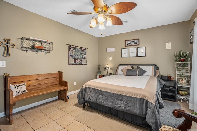bedroom with light tile patterned floors, baseboards, and ceiling fan