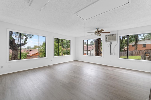 6500 W 12th St, Little Rock, AR 72204 - unfurnished sunroom with healthy amount of natural light and a wall unit AC