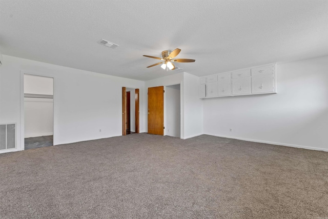 6500 W 12th St, Little Rock, AR 72204 - unfurnished living room with ceiling fan, a textured ceiling, carpet floors, and baseboards