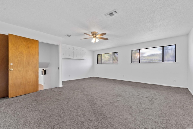 6500 W 12th St, Little Rock, AR 72204 - carpeted spare room featuring a ceiling fan, a textured ceiling, and baseboards