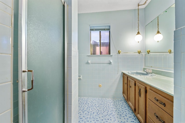 6500 W 12th St, Little Rock, AR 72204 - full bath with a shower stall, vanity, and tile walls