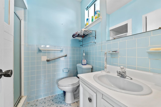 6500 W 12th St, Little Rock, AR 72204 - bathroom featuring a stall shower, tile walls, vanity, and toilet