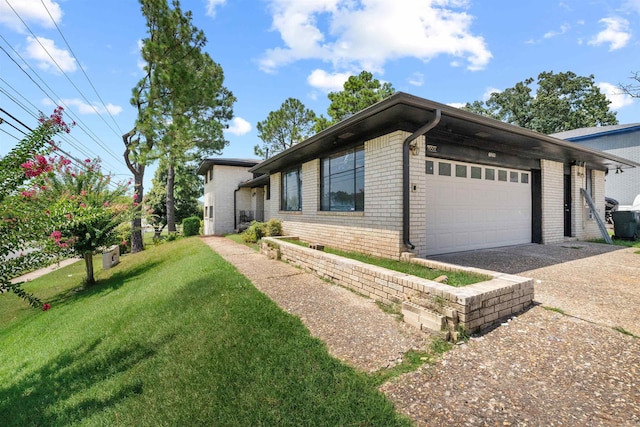 6500 W 12th St, Little Rock, AR 72204 - view of front facade featuring brick siding, concrete driveway, an attached garage, and a front yard
