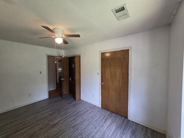 535 Ridgeview Ln, Russellville, AR 72802 - unfurnished bedroom with wood finished floors, a textured ceiling, baseboards, and a ceiling fan