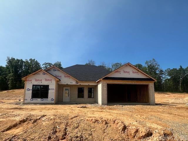 1168 Duke Dr, Bauxite, AR 72011 - property in mid-construction featuring a garage