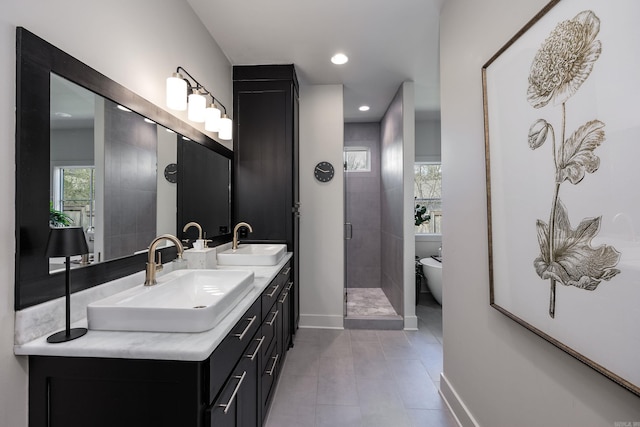 2803 Dalewood Rd, Little Rock, AR 72207 - full bath featuring double vanity, a shower stall, tile patterned flooring, a freestanding bath, and baseboards