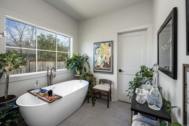 2803 Dalewood Rd, Little Rock, AR 72207 - bathroom featuring a soaking tub and tile patterned floors