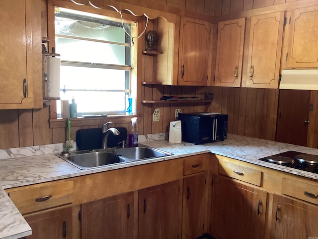 228 Nevada 66 W, Prescott, AR 71857 - kitchen featuring a sink, under cabinet range hood, light countertops, water heater, and black electric stovetop