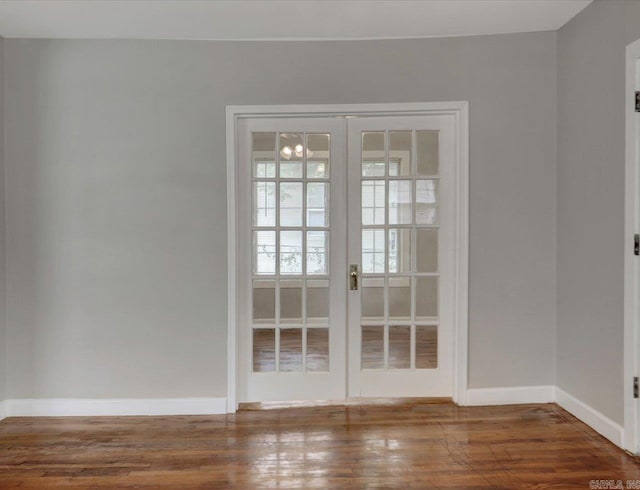 122 Kenwood St, Hot Springs, AR 71913 - empty room featuring french doors, wood finished floors, and baseboards