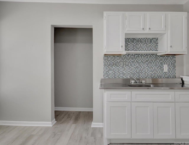 122 Kenwood St, Hot Springs, AR 71913 - kitchen with white cabinets, light wood-type flooring, a sink, and open shelves