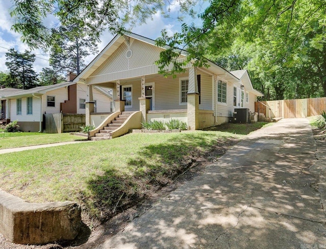 122 Kenwood St, Hot Springs, AR 71913 - view of front facade with covered porch, asphalt driveway, and cooling unit