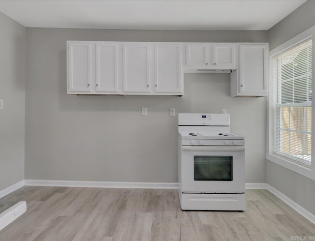 122 Kenwood St, Hot Springs, AR 71913 - kitchen with white range, white cabinetry, light wood finished floors, and baseboards