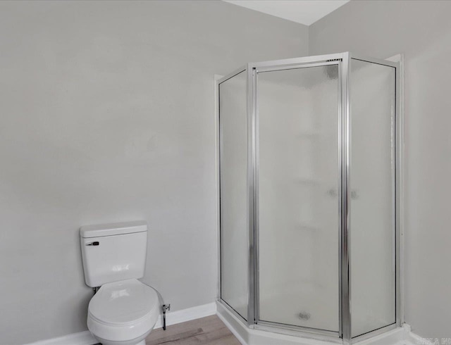 122 Kenwood St, Hot Springs, AR 71913 - bathroom with a stall shower, baseboards, toilet, and wood finished floors