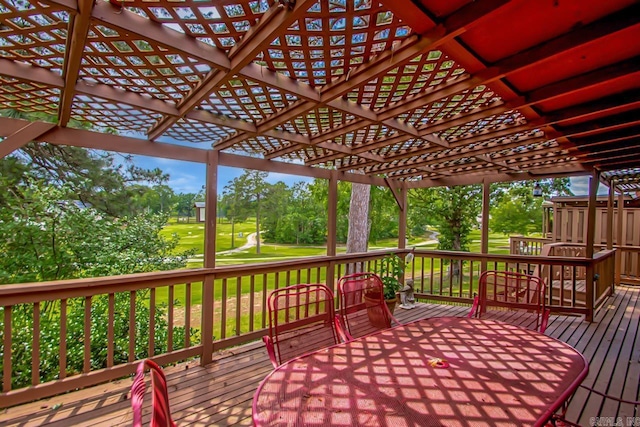 38 Ninth Fairway Loop, Maumelle, AR 72113 - wooden deck featuring outdoor dining area, view of wooded area, view of golf course, a pergola, and a yard