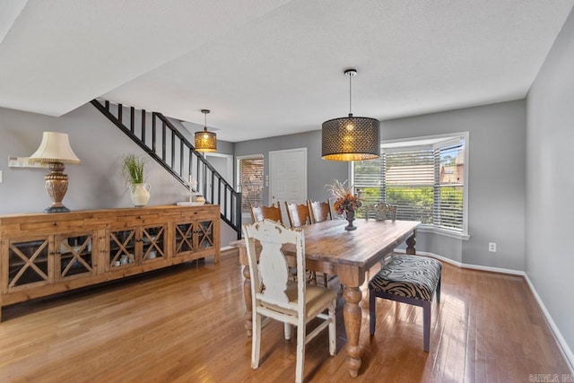 38 Ninth Fairway Loop, Maumelle, AR 72113 - dining area featuring stairway, baseboards, plenty of natural light, and wood finished floors