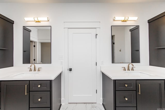 57 Republican Loop, Greenbrier, AR 72058 - bathroom featuring marble finish floors, two vanities, and baseboards