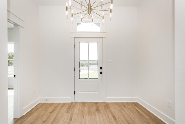 57 Republican Loop, Greenbrier, AR 72058 - entryway with a chandelier, light wood-style flooring, and baseboards