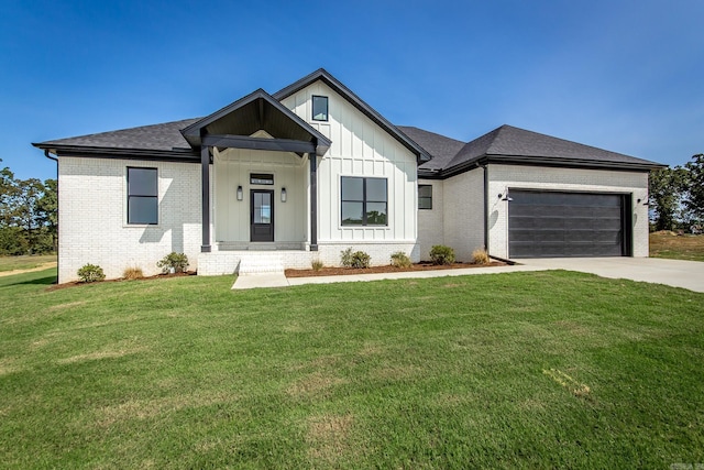 57 Republican Loop, Greenbrier, AR 72058 - modern inspired farmhouse featuring brick siding, driveway, a front yard, a garage, and board and batten siding