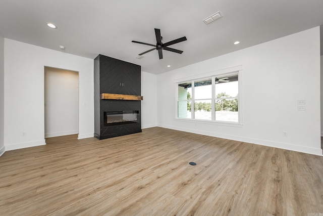 57 Republican Loop, Greenbrier, AR 72058 - unfurnished living room with a fireplace, ceiling fan, light wood-style flooring, baseboards, and recessed lighting