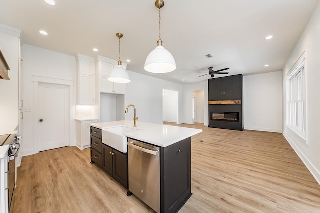57 Republican Loop, Greenbrier, AR 72058 - kitchen with appliances with stainless steel finishes, a sink, ceiling fan, light wood-type flooring, and white cabinetry