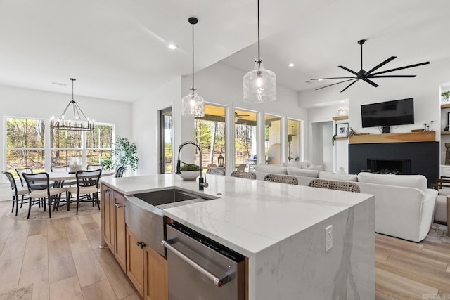2505 Collins Dr, Conway, AR 72058 - kitchen with dishwasher, a sink, a fireplace, light wood-style floors, and recessed lighting