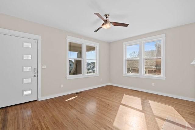 212 Barton St, Little Rock, AR 72205 - foyer entrance with ceiling fan, wood finished floors, and baseboards