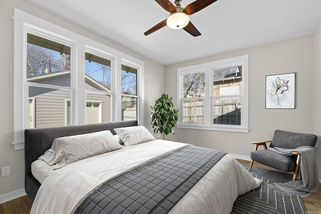 212 Barton St, Little Rock, AR 72205 - bedroom with baseboards, wood finished floors, and a ceiling fan