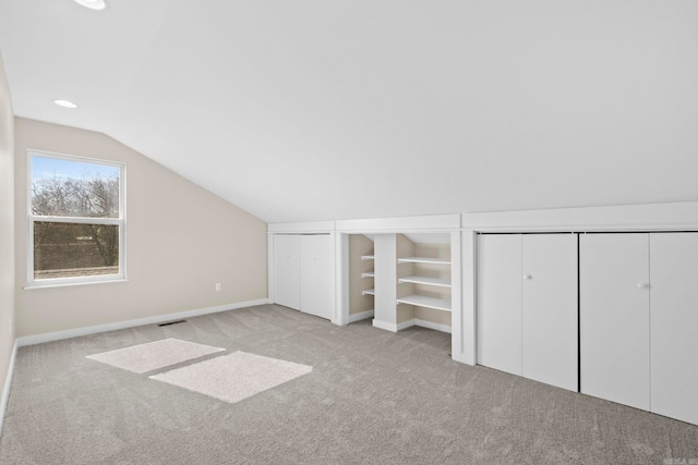 212 Barton St, Little Rock, AR 72205 - additional living space with carpet floors, vaulted ceiling, baseboards, recessed lighting, and built in shelves