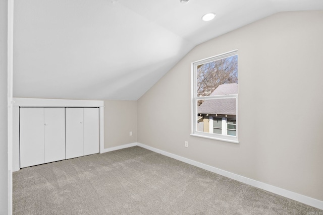 212 Barton St, Little Rock, AR 72205 - additional living space with vaulted ceiling, carpet flooring, and baseboards