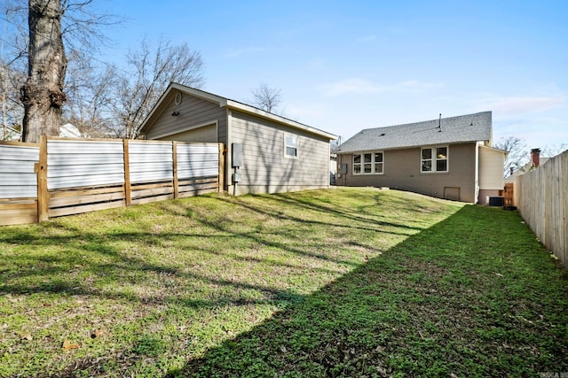 212 Barton St, Little Rock, AR 72205 - rear view of house with central AC and a garage