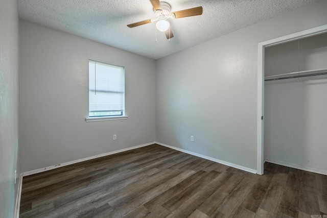 1716 Walnut St, Arkadelphia, AR 71923 - unfurnished bedroom with dark wood-style flooring, a closet, a textured ceiling, a ceiling fan, and baseboards