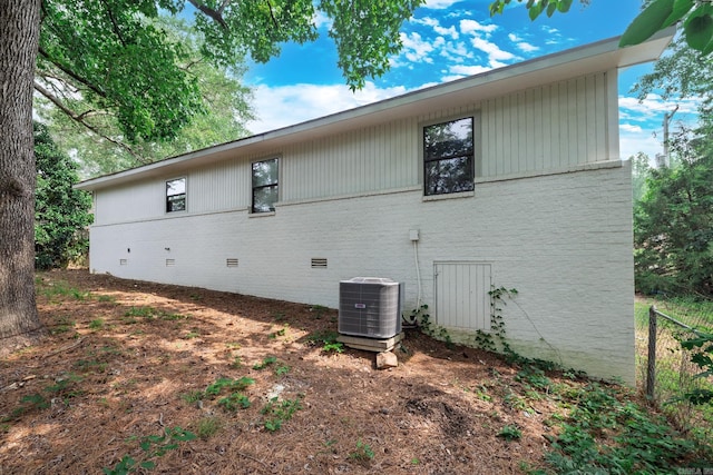1716 Walnut St, Arkadelphia, AR 71923 - view of side of home with central AC unit and brick siding