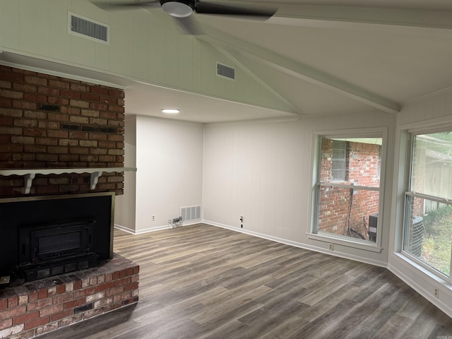 unfurnished living room featuring ceiling fan, wood finished floors, and baseboards