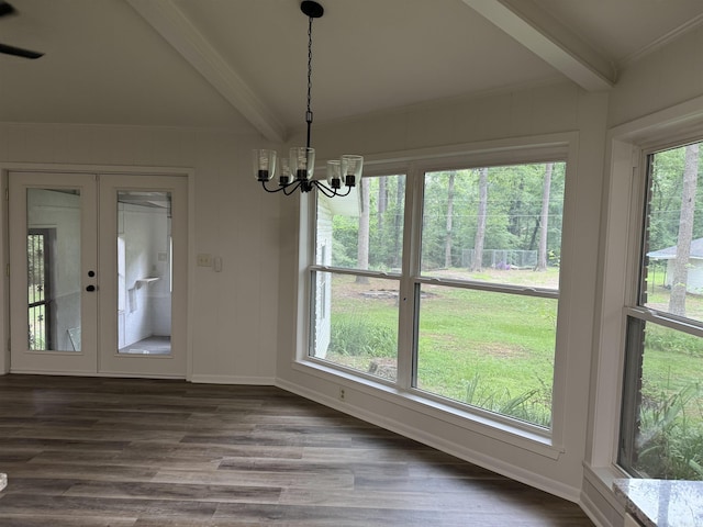 unfurnished sunroom with french doors and a chandelier