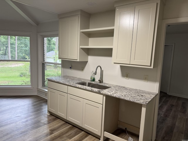 kitchen featuring a sink, dark wood-style flooring, open shelves, light stone countertops, and white cabinets