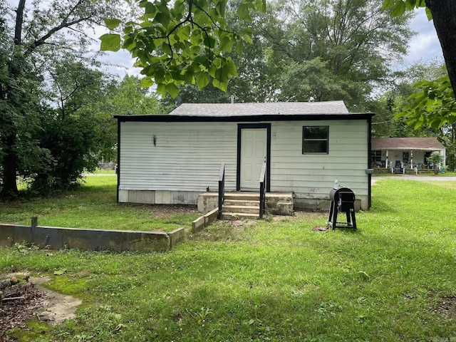 202 Roosevelt, Jacksonville, AR 72076 - rear view of property featuring a lawn