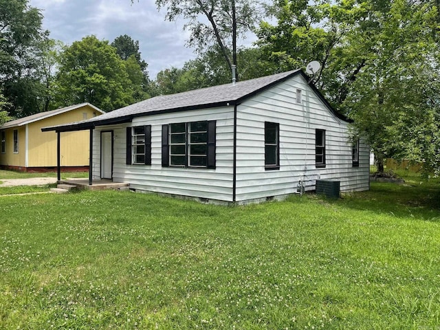 202 Roosevelt, Jacksonville, AR 72076 - view of home's exterior with crawl space, a yard, central AC, and view of wooded area