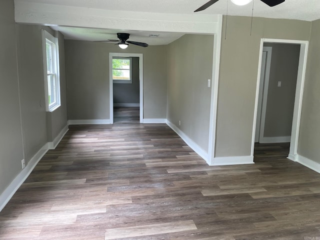 202 Roosevelt, Jacksonville, AR 72076 - unfurnished room with ceiling fan, baseboards, dark wood-type flooring, and a textured ceiling