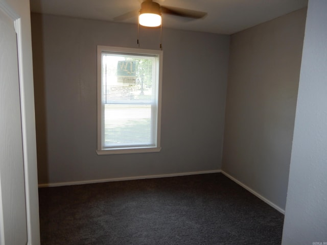 100 Douglas, Judsonia, AR 72180 - spare room featuring a ceiling fan, dark colored carpet, and baseboards