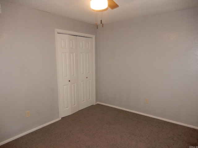 100 Douglas, Judsonia, AR 72180 - unfurnished bedroom with dark colored carpet, a closet, baseboards, and ceiling fan