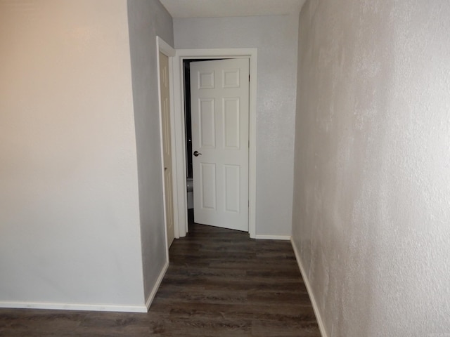 100 Douglas, Judsonia, AR 72180 - hallway with dark wood-style flooring and baseboards