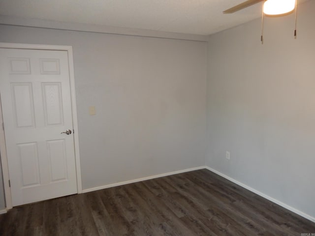 100 Douglas, Judsonia, AR 72180 - unfurnished room with dark wood finished floors, a ceiling fan, and baseboards