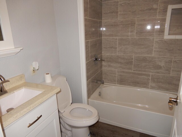 100 Douglas, Judsonia, AR 72180 - full bath with toilet, vanity, shower / bathtub combination, and wood finished floors