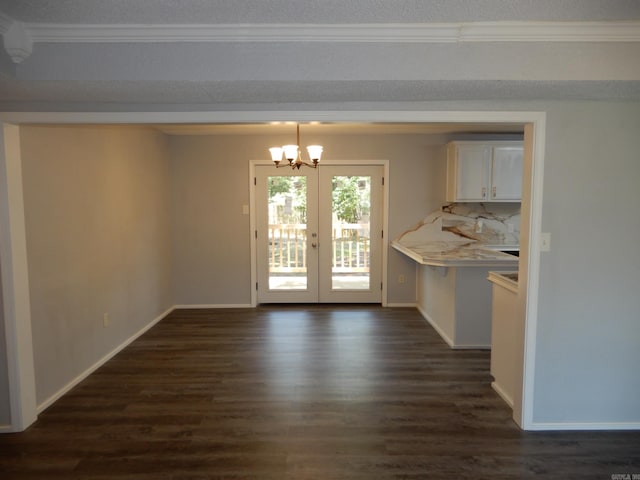 100 Douglas, Judsonia, AR 72180 - unfurnished dining area featuring dark wood-style flooring, a chandelier, ornamental molding, baseboards, and french doors
